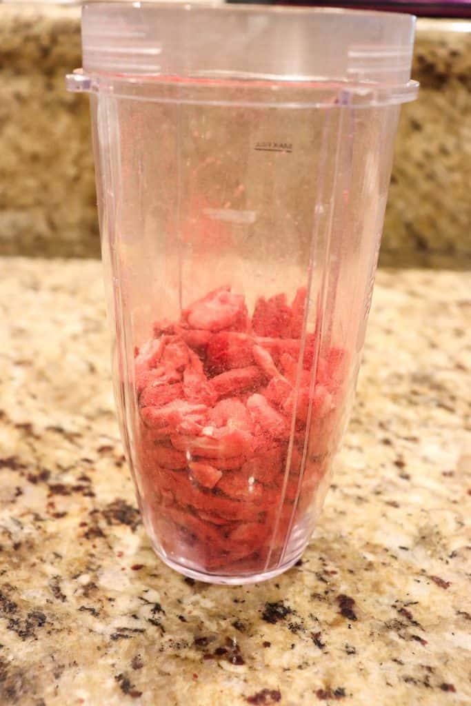 The Oreos and dried strawberries placed in the blender.