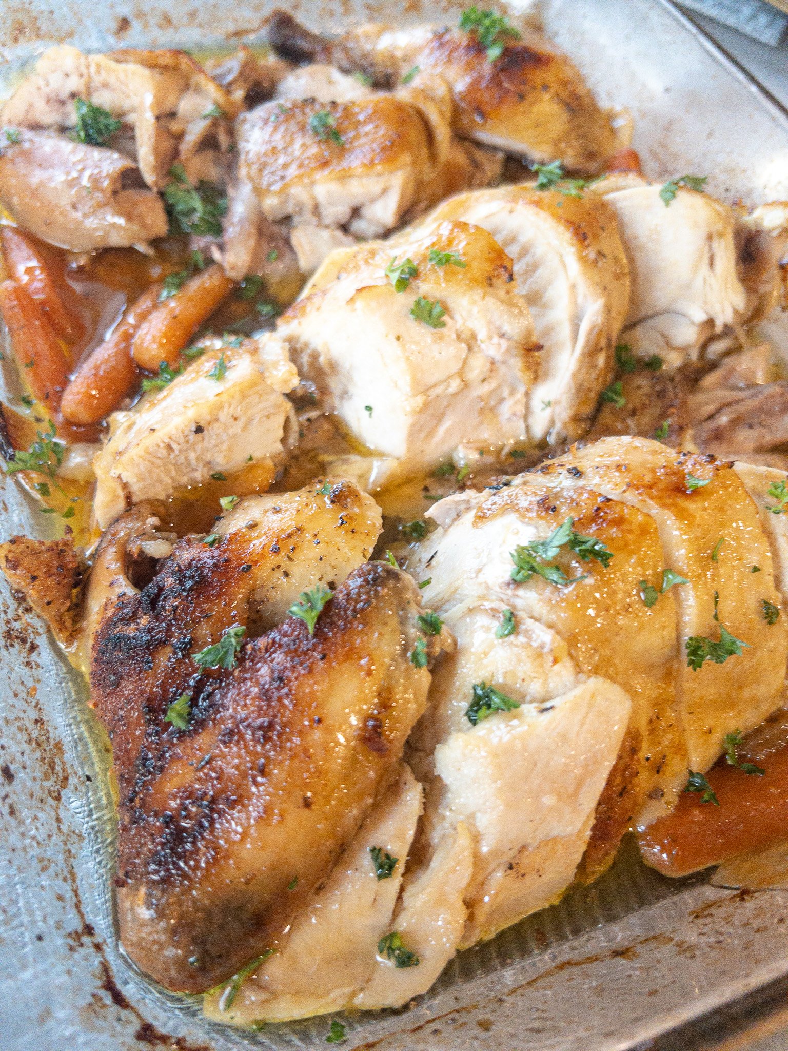 oven roasted chicken cut up in baking dish