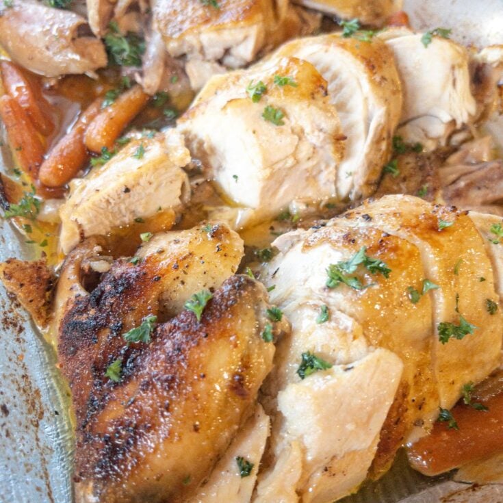 oven roasted chicken in a baking dish cut into portions