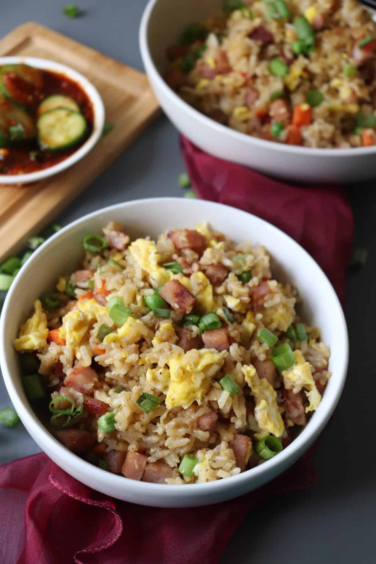 Leftover Pork Fried Rice in a bowl with a red towel underneath