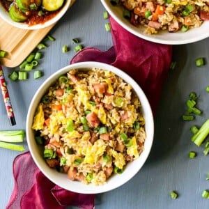 pork fried rice in a bowl with a red napkin underneath it