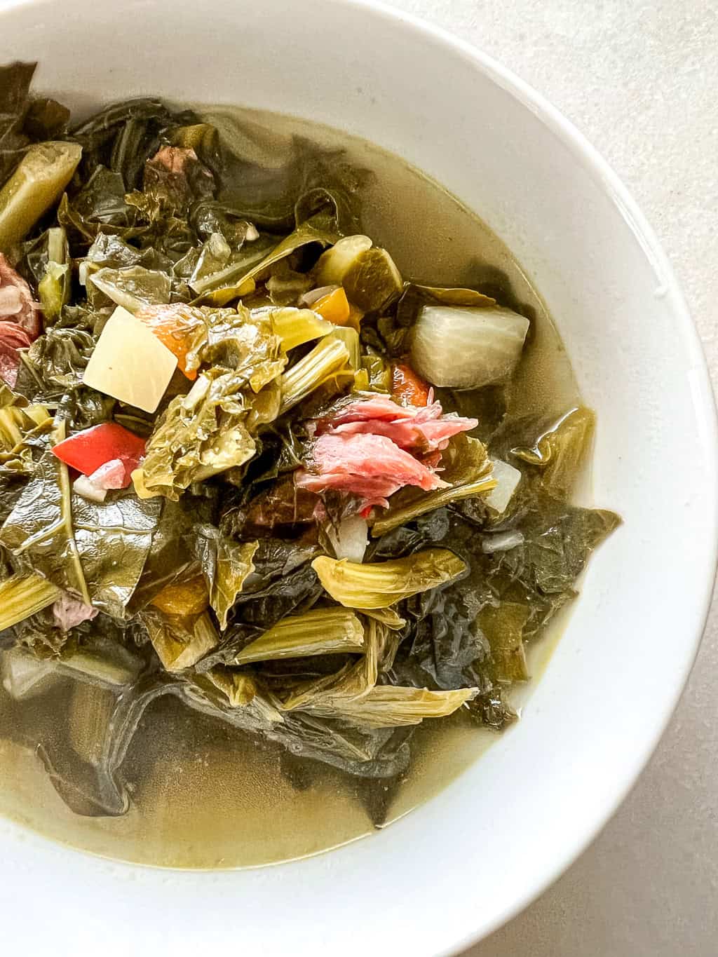 close up of a bowl of collard greens