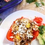 stuffing oozing out of Cheesy Taco Stuffed Peppers with Beef