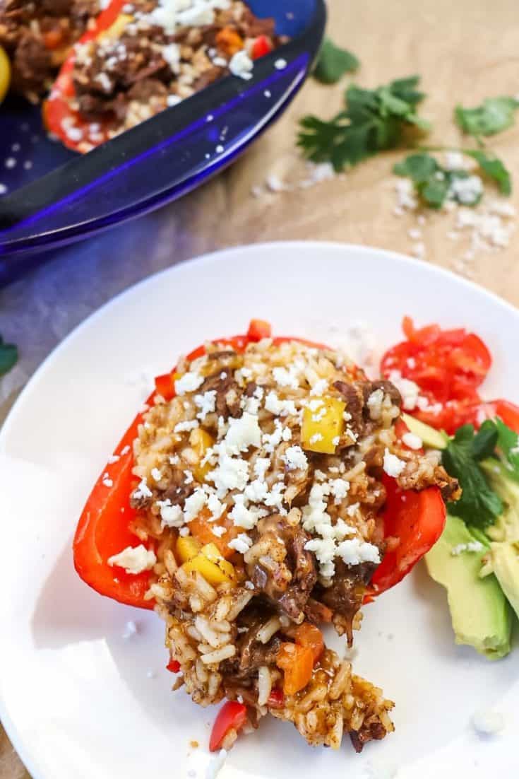 stuffing oozing out of Cheesy Taco Stuffed Peppers with Beef