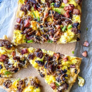 slices of breakfast pizza at a side angle