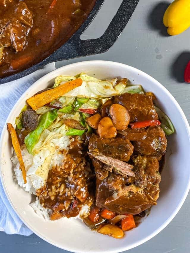 overhead view of plated oxtails in a bowl