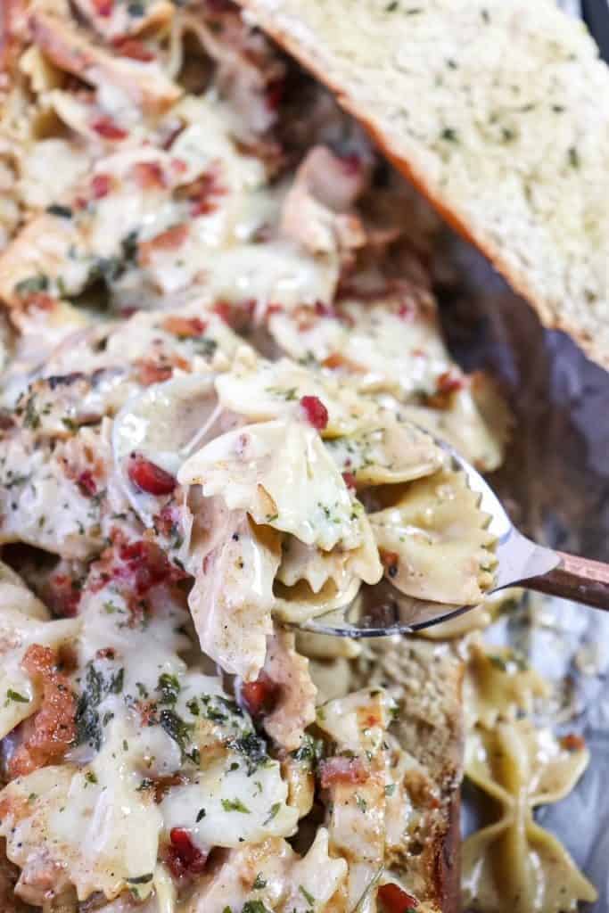 close up of pasta served in a loaf of bread