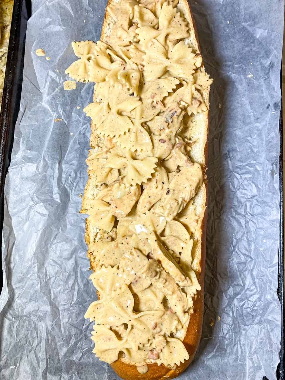 placed chicken alfredo into loaf of bread