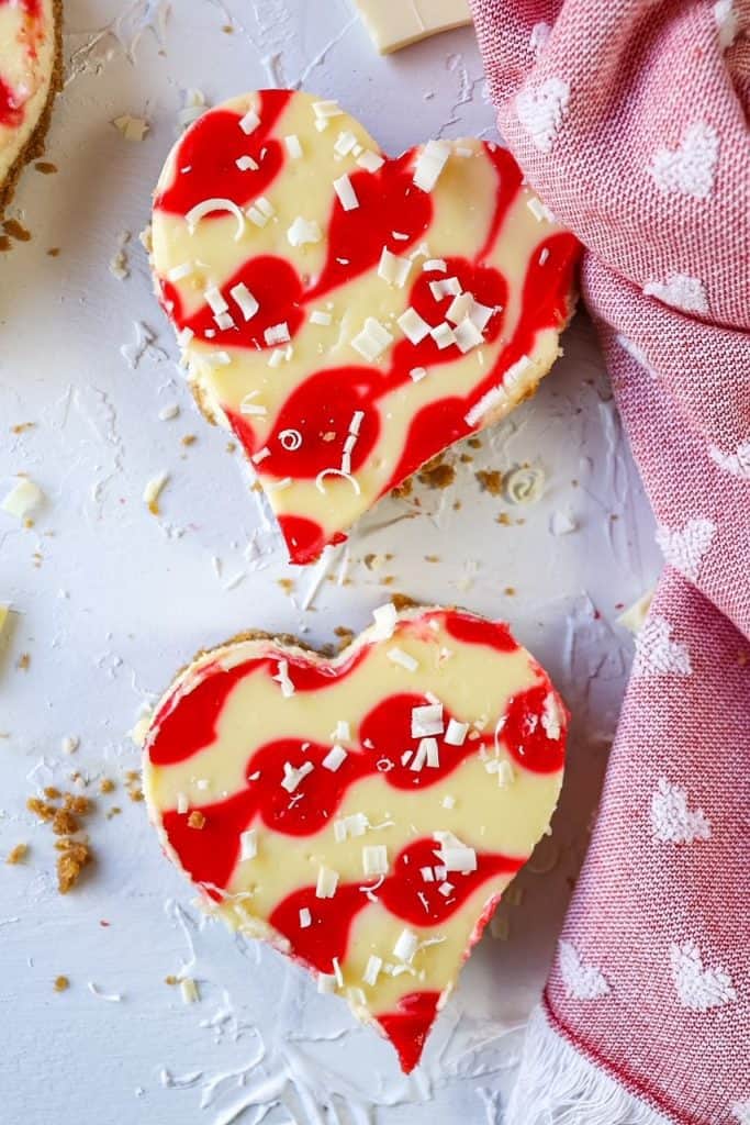 heart shaped cheesecakes on a board