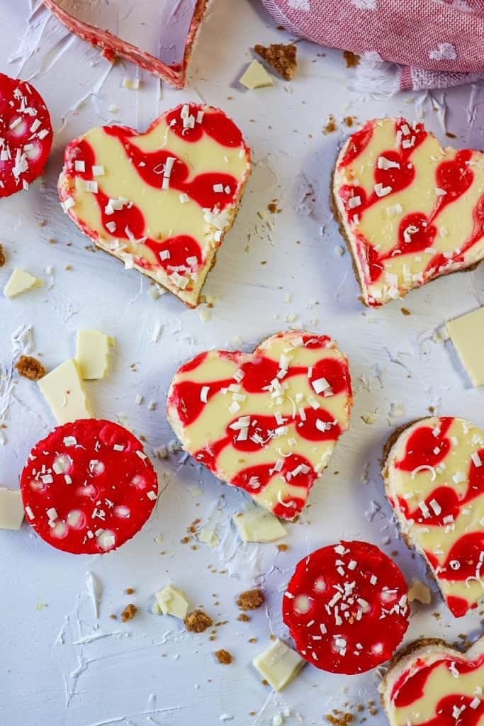 heart shaped cheesecakes on a board