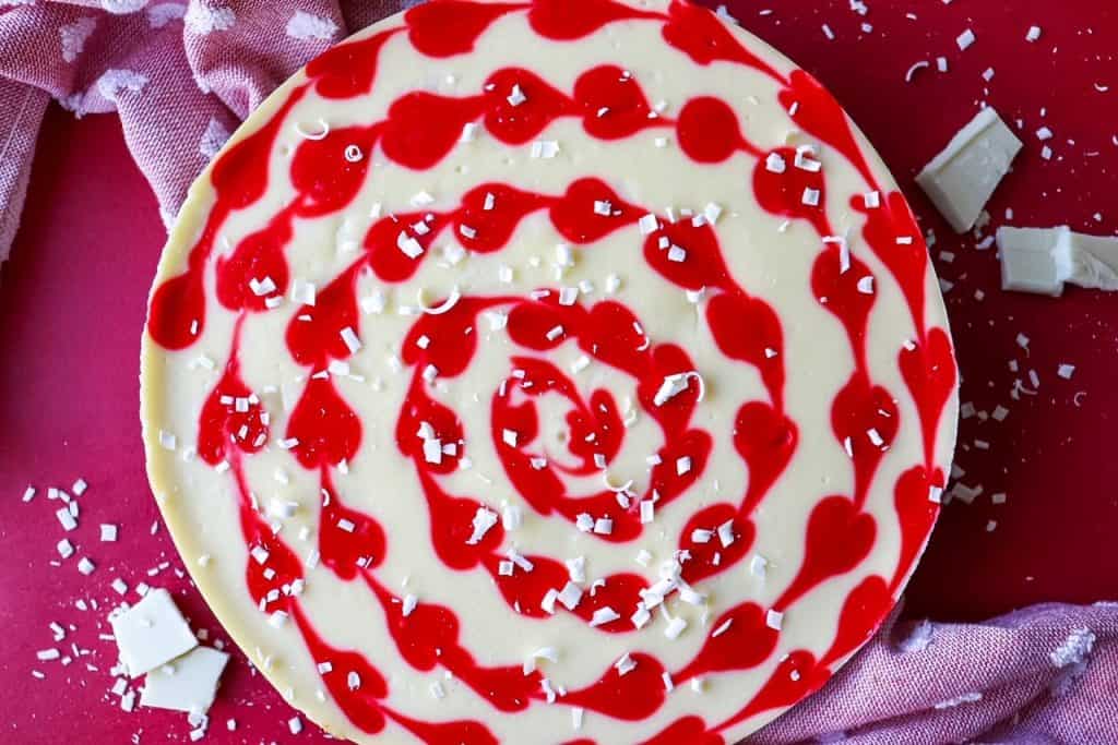 overhead horizontal view of whole red velvet swirl cheesecake