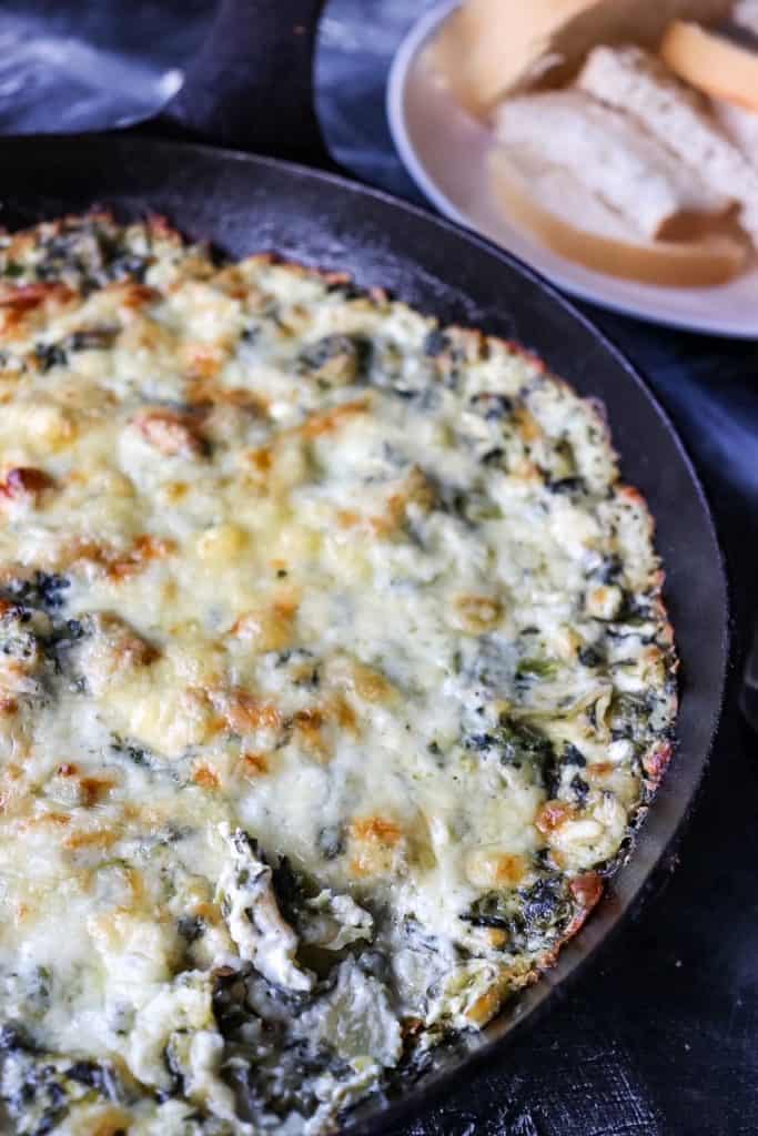 overhead view of spinach dip in a cast iron skillet