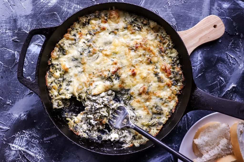 overhead view of spinach dip in a cast iron skillet