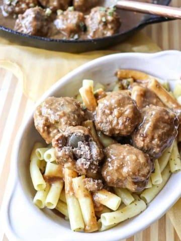 close up of swedish meatballs over pasta