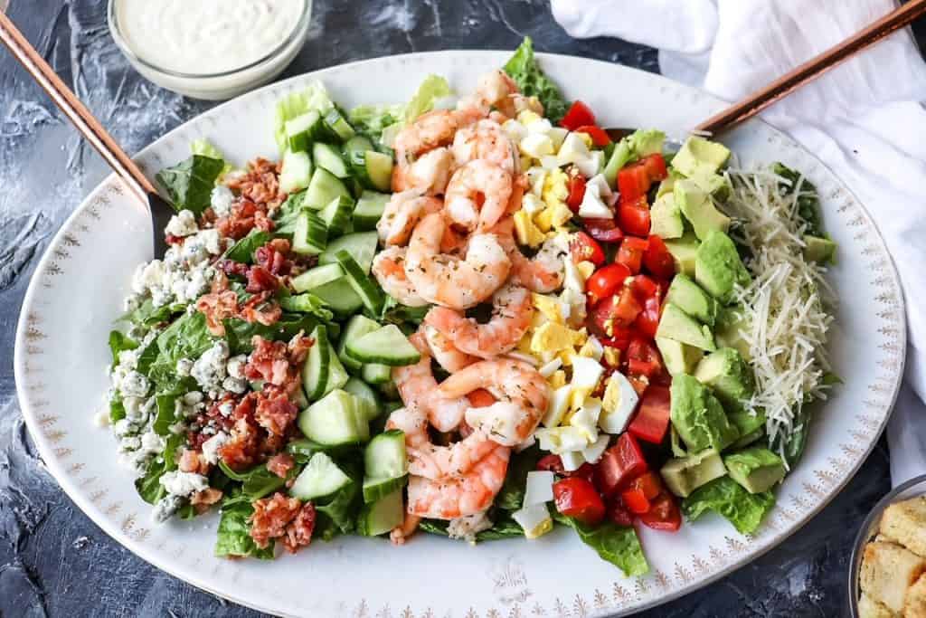 a platter of shrimp cobb salad