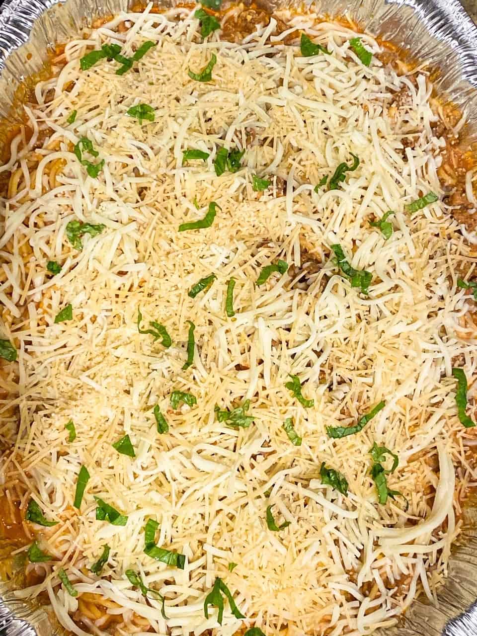 overhead view of baked spaghetti ready to be put in the oven