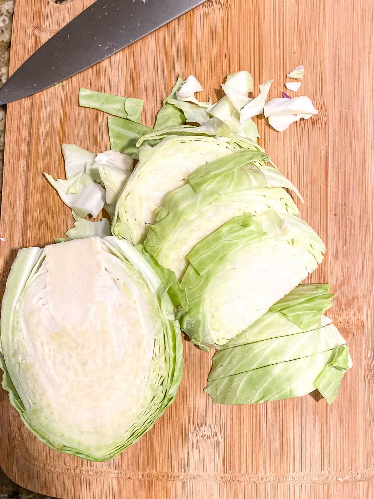 raw cabbage on a cutting board to make fried cabbage
