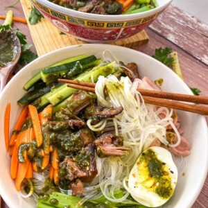 vermicilli noodles in a bowl with vegetables