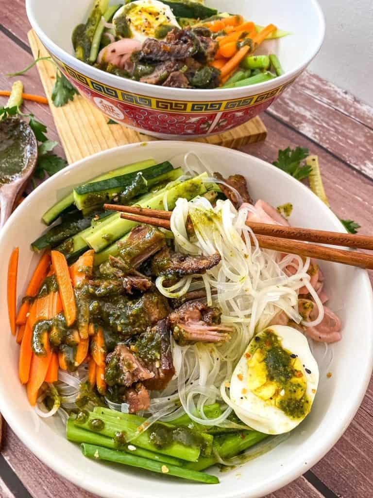 vermicilli noodles in a bowl with vegetables