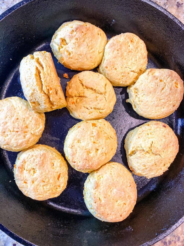 Overhead view of cooked Sweet Potato Biscuits in a skillet.