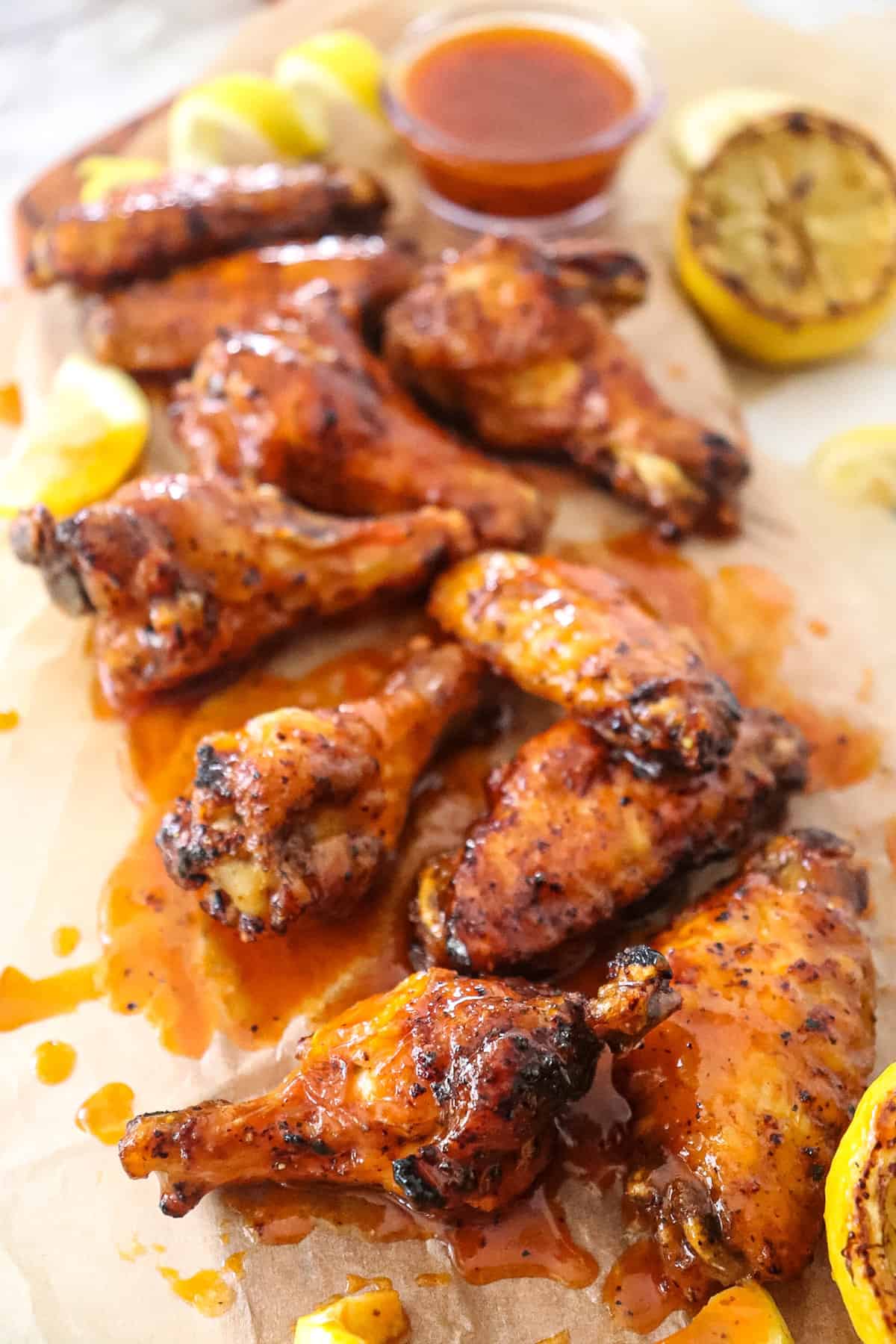 hot honey lemon pepper wings on parchment paper