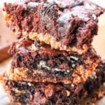 Close up view of three sliced Oreo Chocolate Chip Brookies stacked.