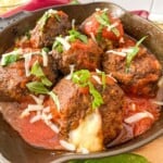 cheese oozing out a meatball