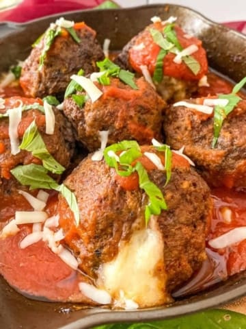 cheese oozing out a meatball