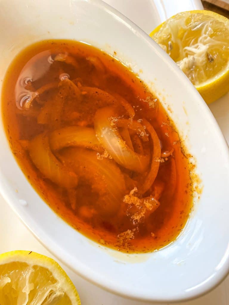 a bowl filled with garlic butter sauce