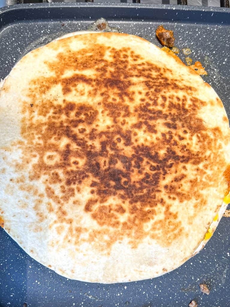 quesadilla on a skillet cooking