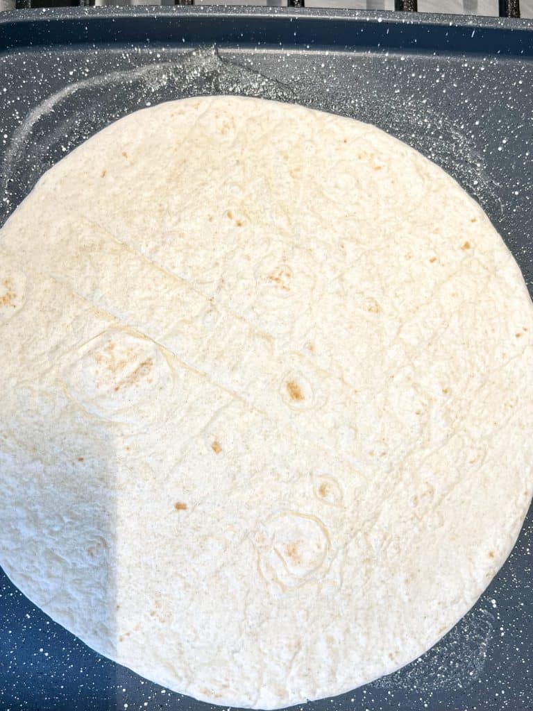 tortilla on a skillet for a quesadilla