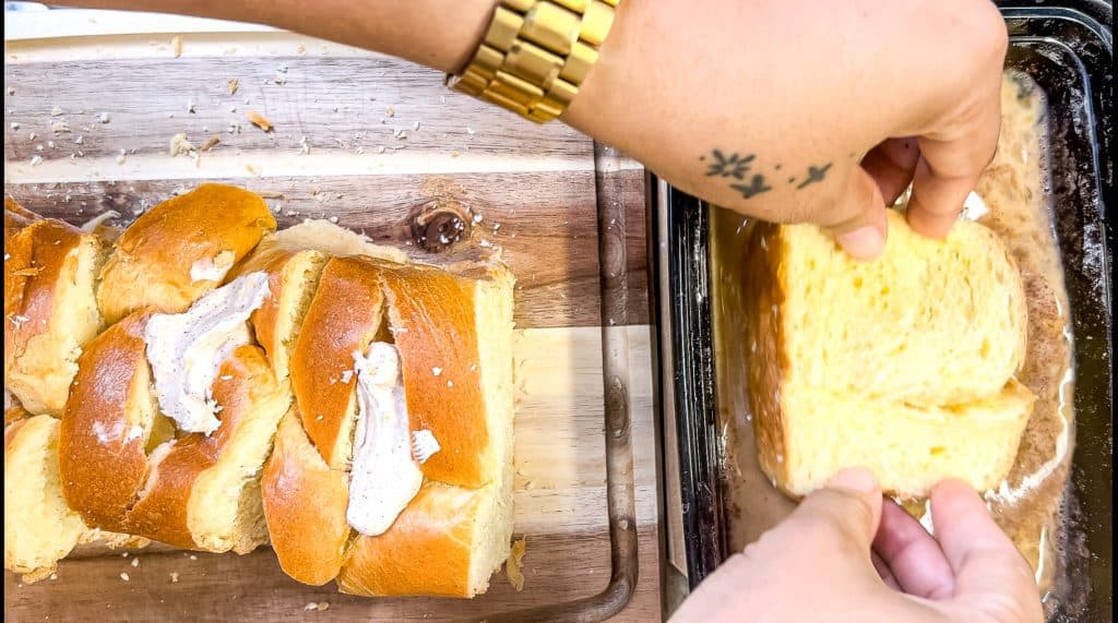 coating stuffed French toast in a custard mix