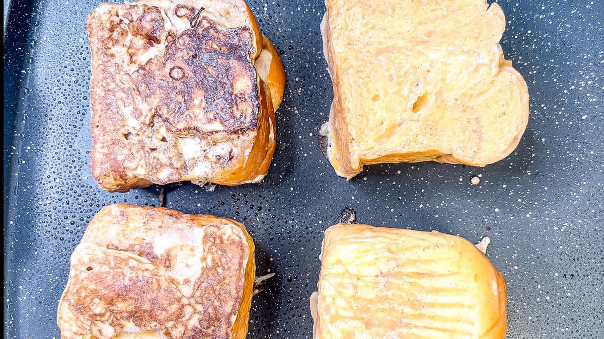 stuffed French toast is cooking on a hot skillet