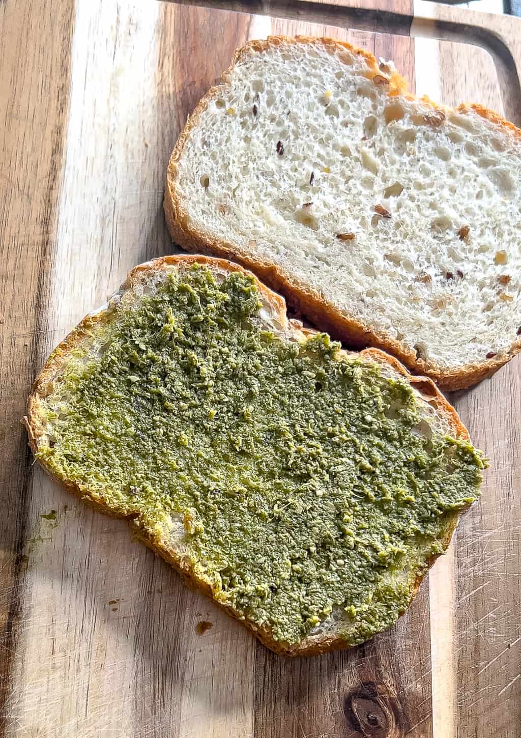 building a pesto grilled cheese sandwich