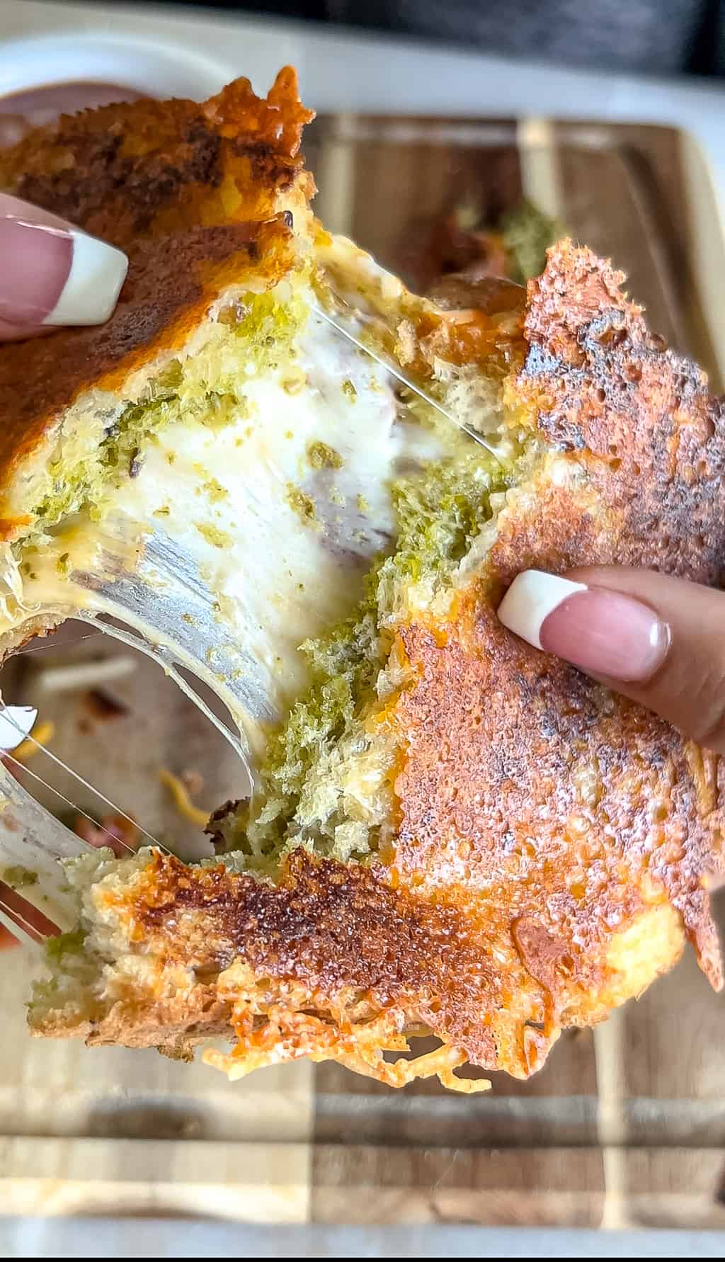 cheese pull from a pesto grilled cheese
