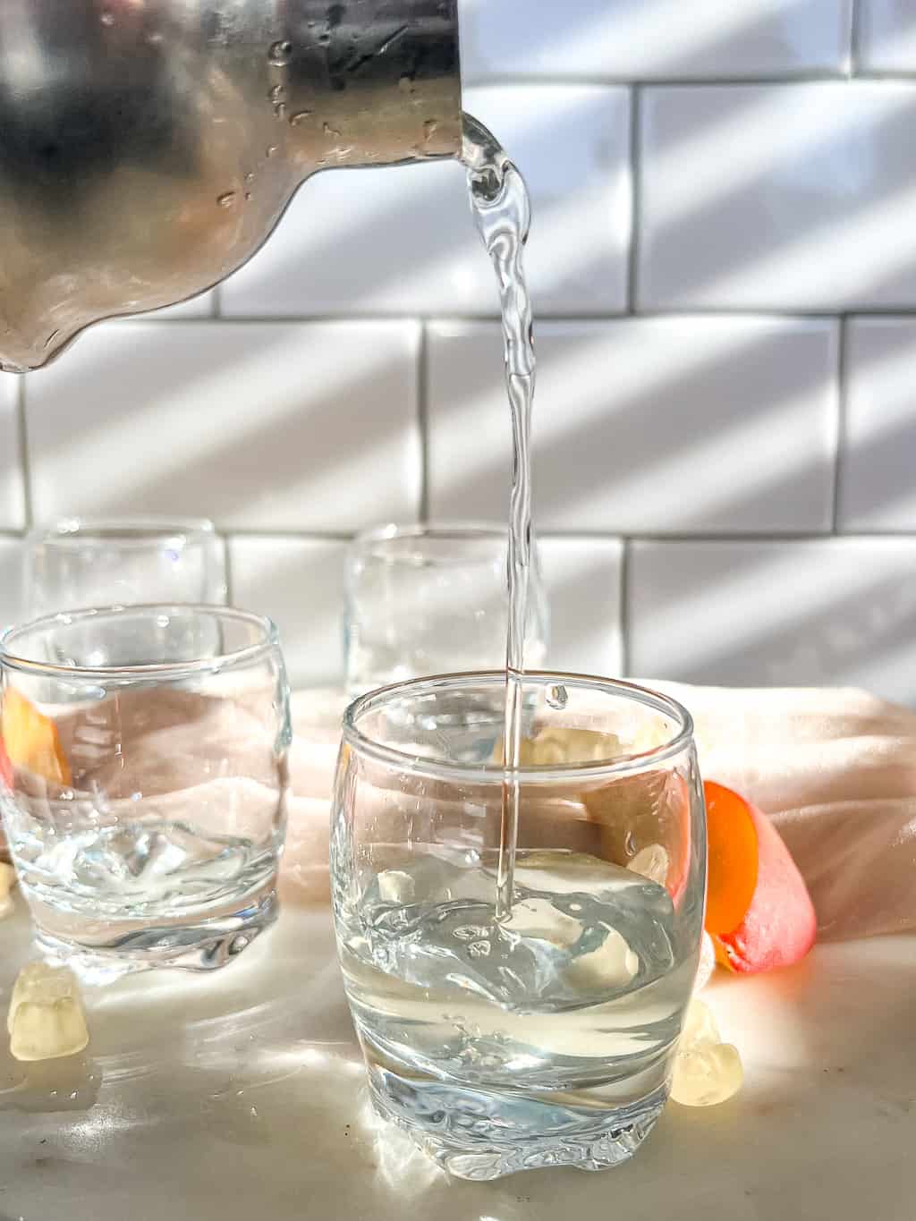 alcohol being poured into a shot glass