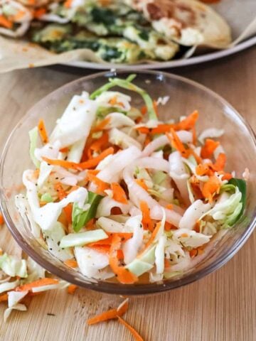 Salvadoran curtido slaw in a small bowl on the table