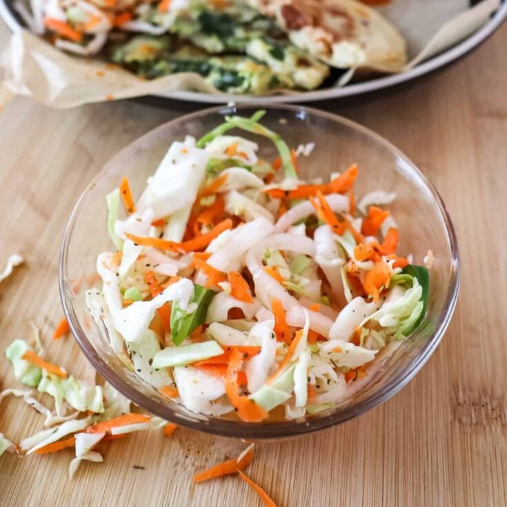 Salvadoran curtido slaw in a small bowl on the table
