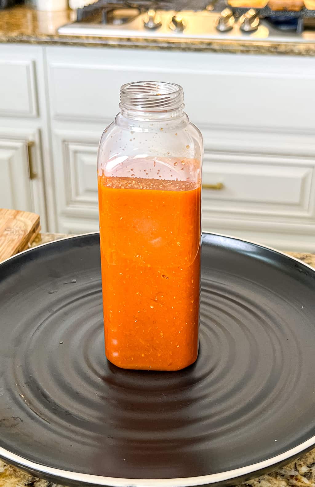 salsa roja that has been prepared and placed in a bottle for storage
