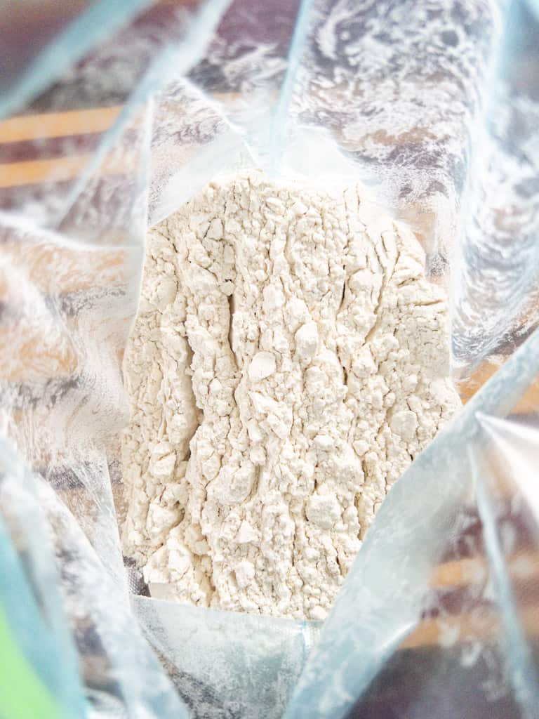 a plastic bag full of seasoned flour