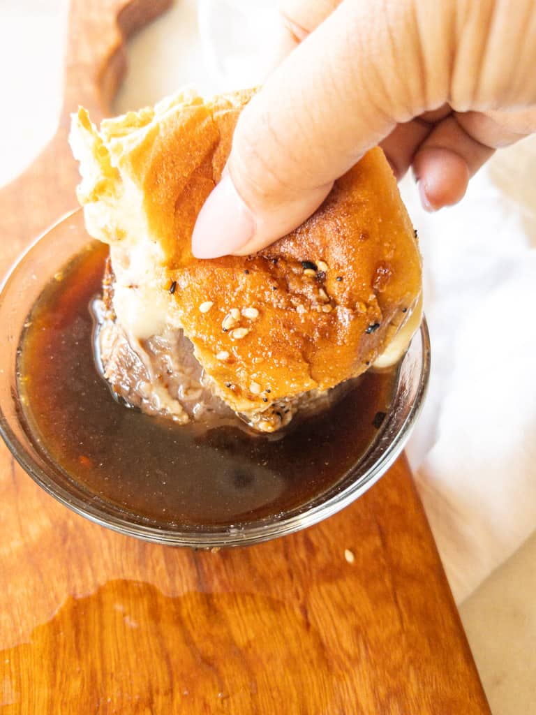 slider being dipped into au jus
