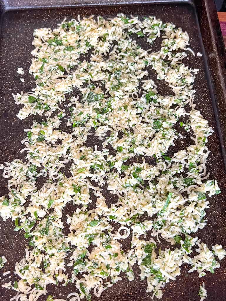baking sheet full of garlic parmesan mixture