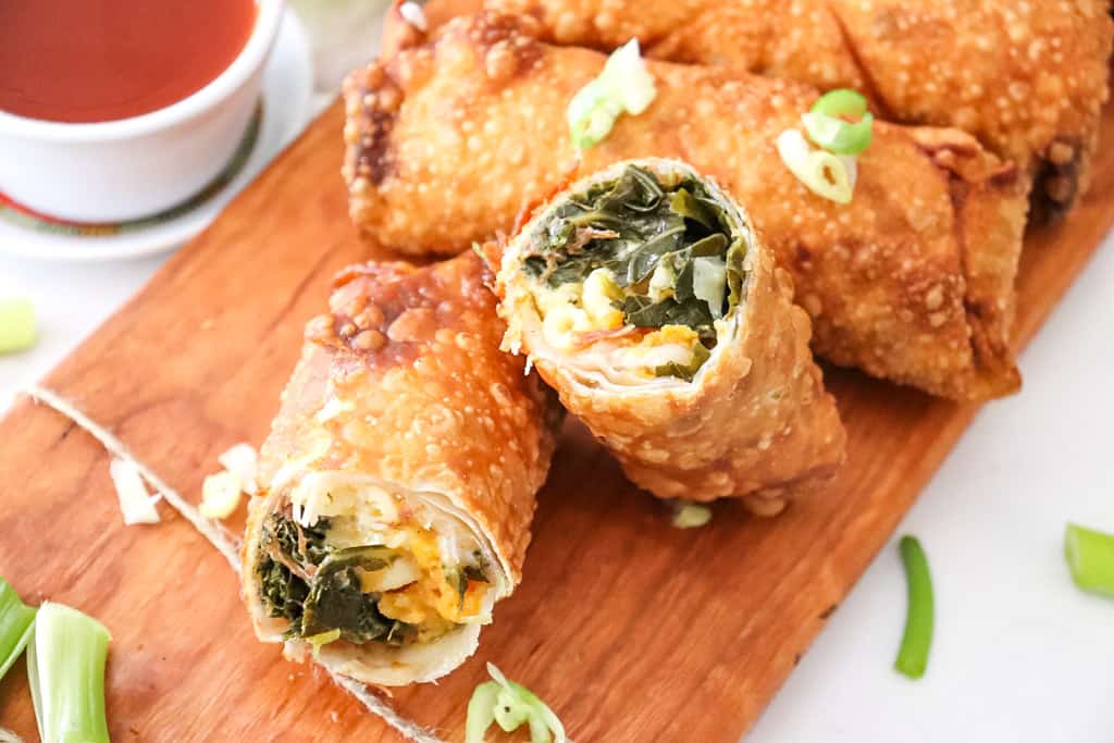 soul food egg rolls cut open sitting on a cutting board