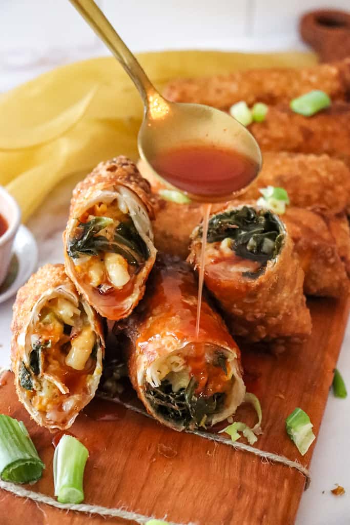 soul food egg rolls cut open sitting on a cutting board