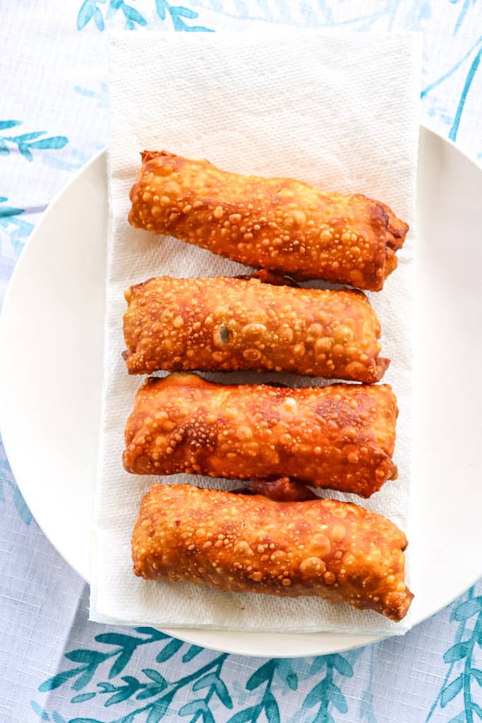 soul food egg rolls fried sitting on a napkin to drain grease