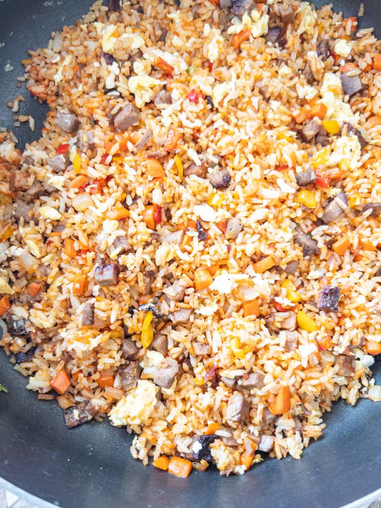close up of rice frying in a skillet
