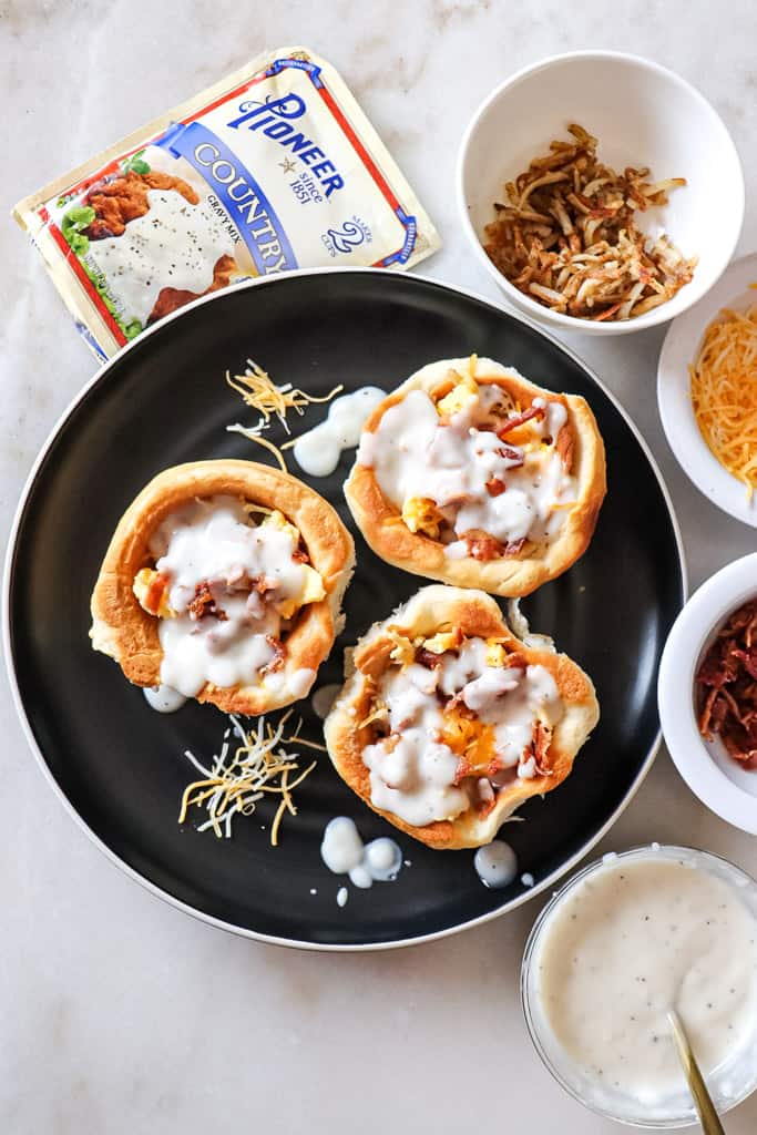 plated biscuit breakfast bowls surrounded by ingredients