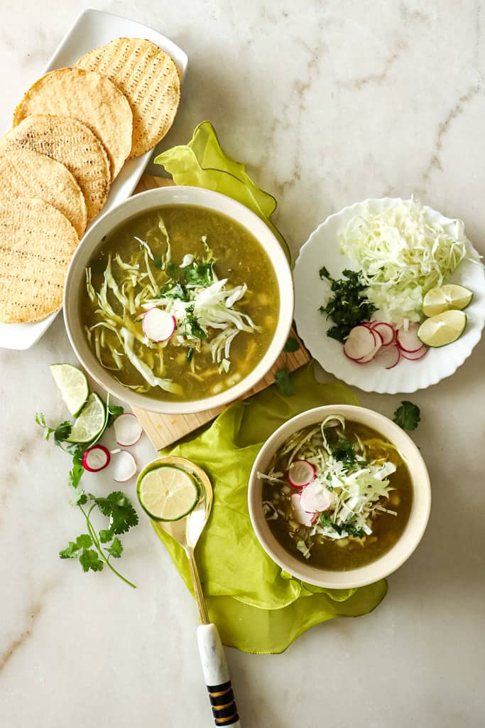 pozole verde with sides and toppings