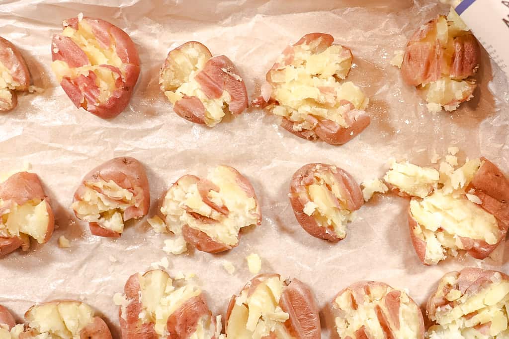 smashed potatoes on a baking sheet