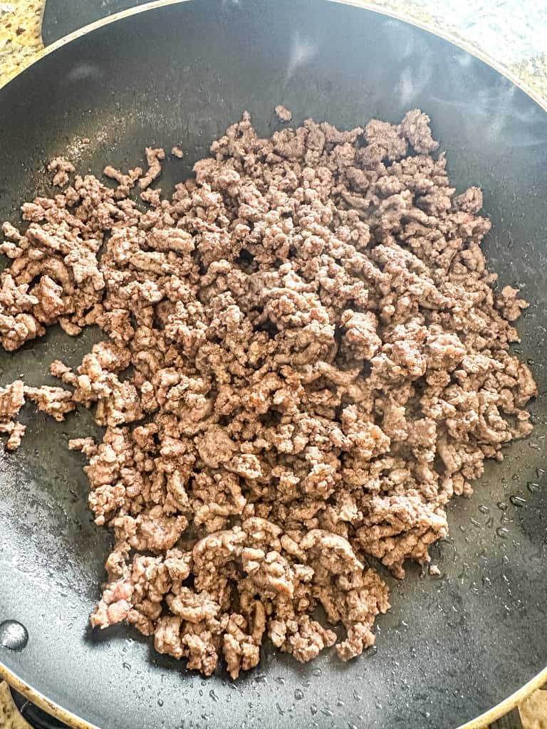 ground beef cooking in a skillet